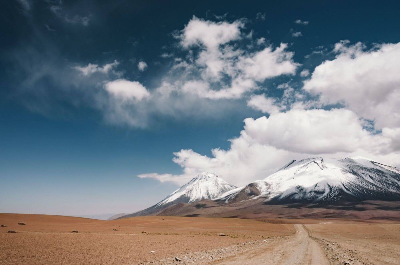 Dry landscape with a snowy mountain in the background